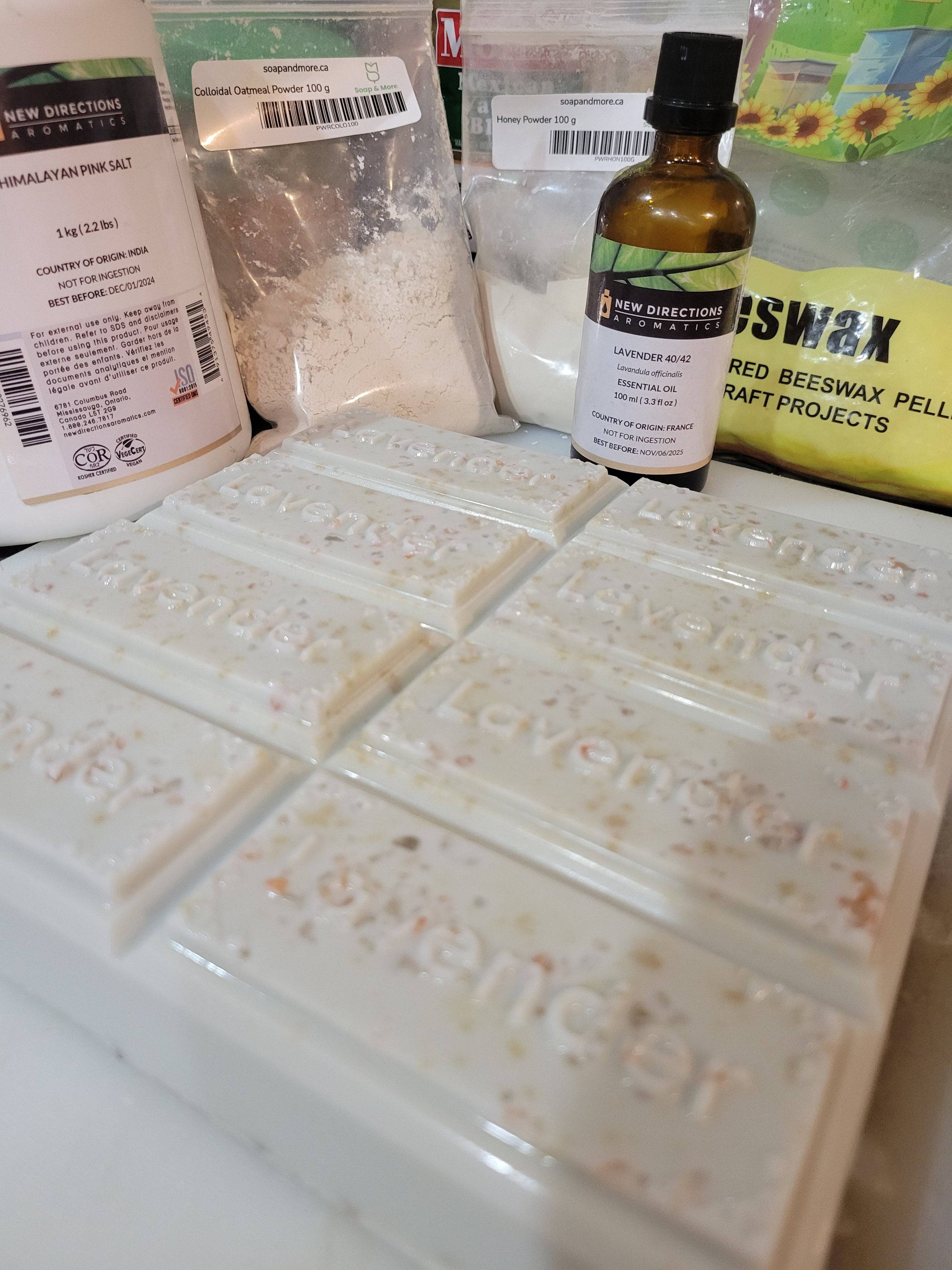 Showing ingredients used in Colloidal Oatmeal Soap- French Lavender & Raw Honey-Himalayan Salt Soap -exfoliating, Botanical  Holistic wildcrafted soothing,  Spa Gift Basket- 4oz "Lavender"rectangle bars -BetterSkin Holistics Honey Powder, Oatmeal powder , Himalayan Rock Salt, French lavender Essential Oil, Beeswax in a vegetable glycerin soap base