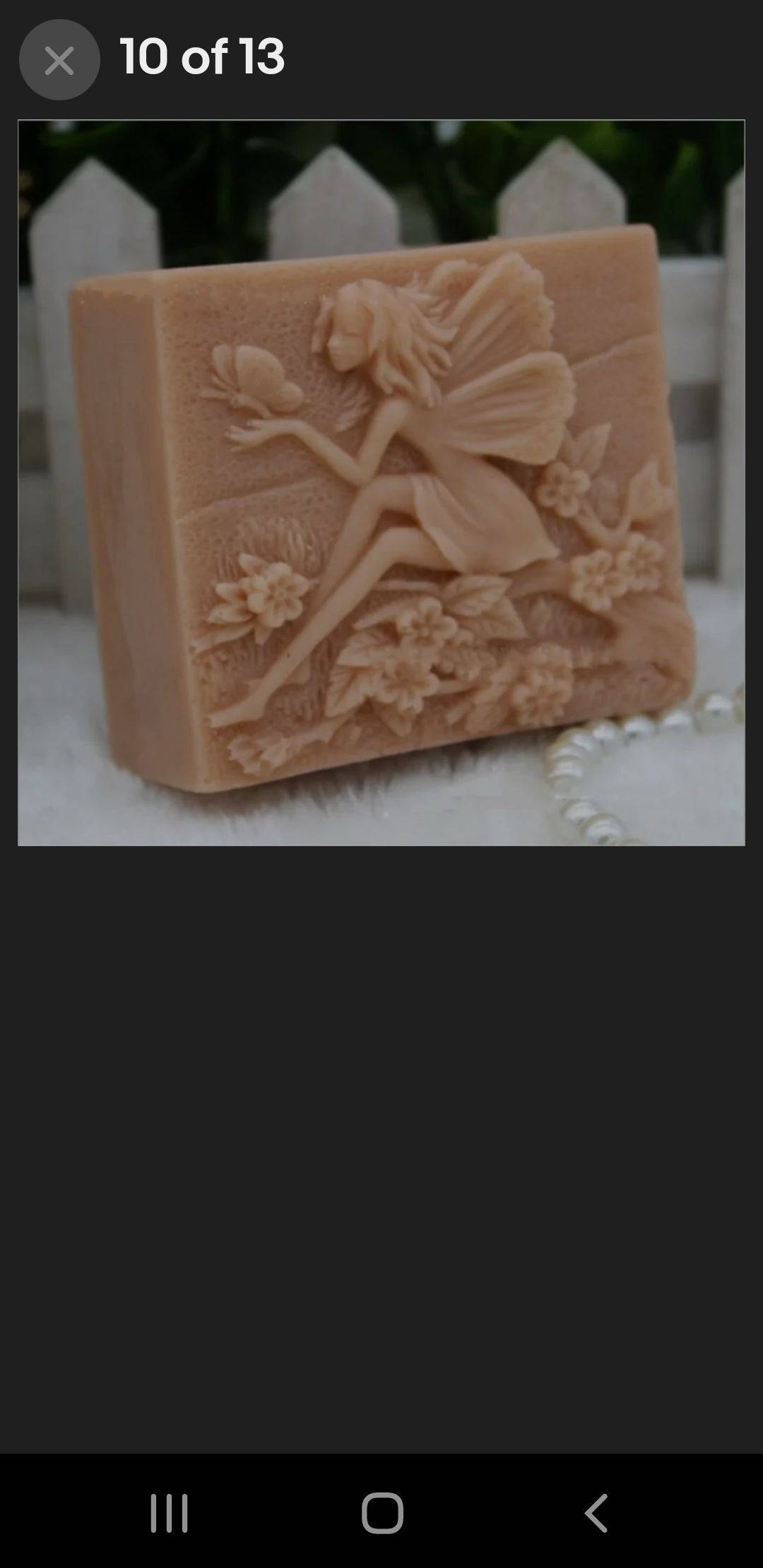 Shown for the design- Blueberry Cocoa Butter Wild crafted Folklore themed soap spa giftbaskets -BeTTerSkin Holistics  Square 5oz bar Fairy sitting holding butterfly surrounded by flowers