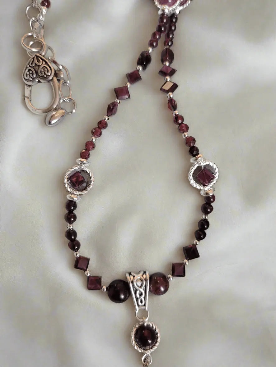 Red garnet Almandine-Pyrope necklace,  details, handmade, all red garnet beading, in a pattern of Rectangle, square and round garnet beads w hematite accent beads and a celtic Knot finding, Veres Celtic Designs 