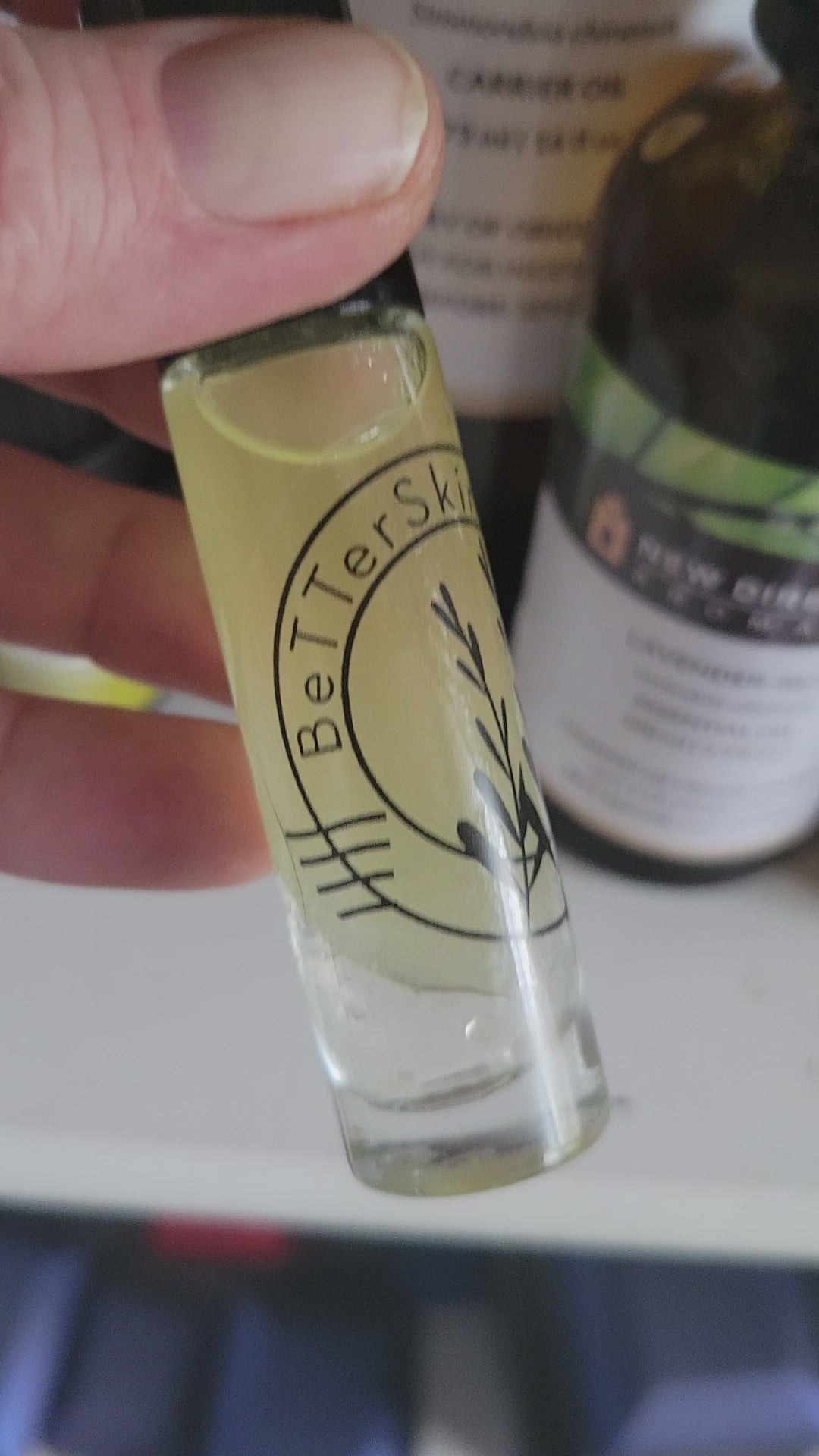 Video of 10 ml roll on bottle containing 
 BetterSkin Holistics  Wildcrafted  Botanical Raw Infused Skin Calming  Body Oil -Moringa Oil, Jojoba Oil, AloeVera Juice, Essential Oils Of Chamomile, Lavender, Bergamot 
Chemical Synthetic  & Detergent FREE  eczema , psoriasis,, dry, effective skincare