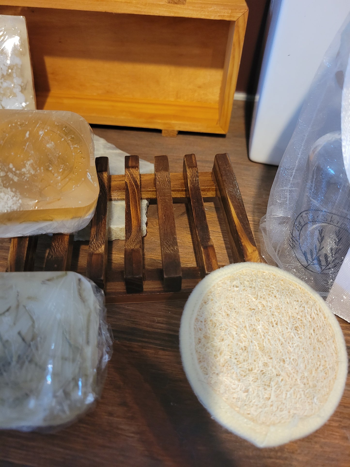 BeTTerSkin Holistics  Wildcrafted,  raw infused, spa baskets all Include this wooden soap drying rack , and a natural Loofah Face cleansing pad